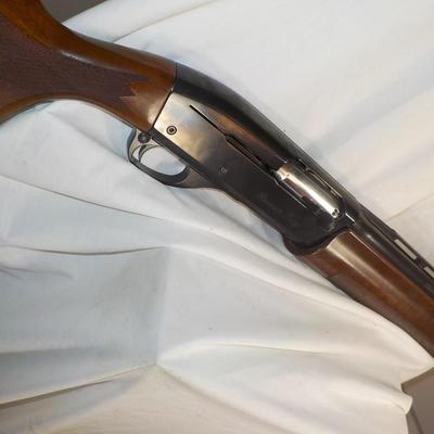 Famous Remington 11-87 Premiere Trap 12 gauge shot gun/ est $400 to $900.