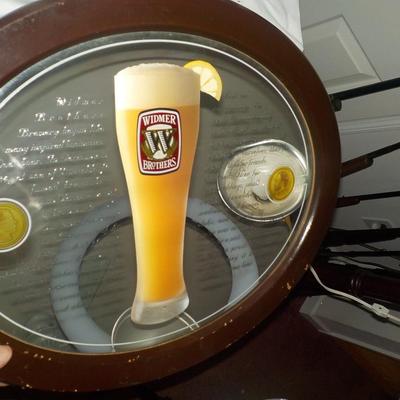 Beer sign Widmer Brothers Beer/ Oval mirror w/ writing. est. $20 to $40.