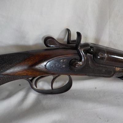 1880 double barrel shot gun, does fire regular shells. / est. $180 to $260.