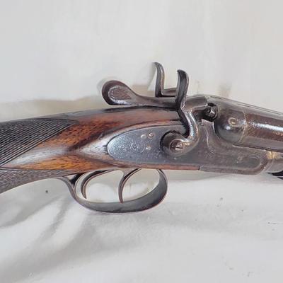 1880 double barrel shot gun, does fire regular shells. / est. $180 to $260.