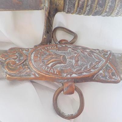 The Woodsman of the World sword and metal scabbard. /est. $100 to $200.