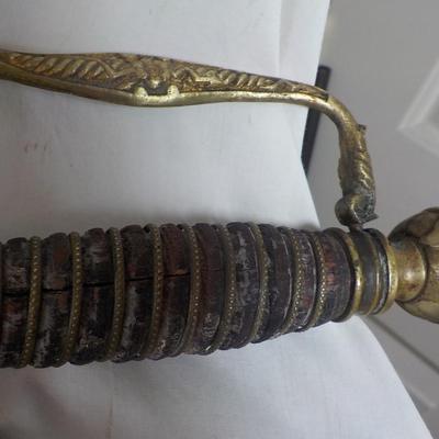 The Woodsman of the World sword and metal scabbard. /est. $100 to $200.