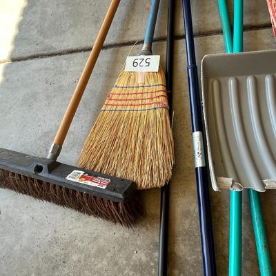 Various Brooms and Scoop Shovel