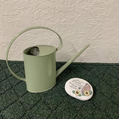 Watering Can and Decorative Rock
