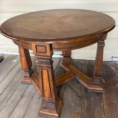 Small round brown wood table