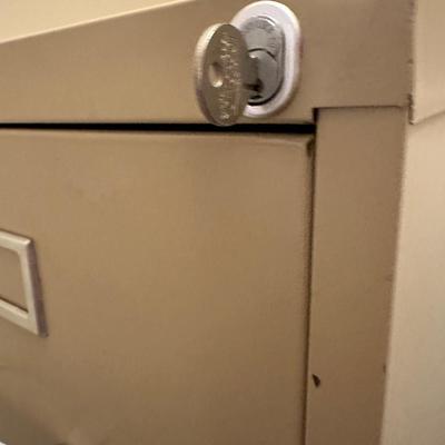2 File Cabinets -Tall one W/ Key