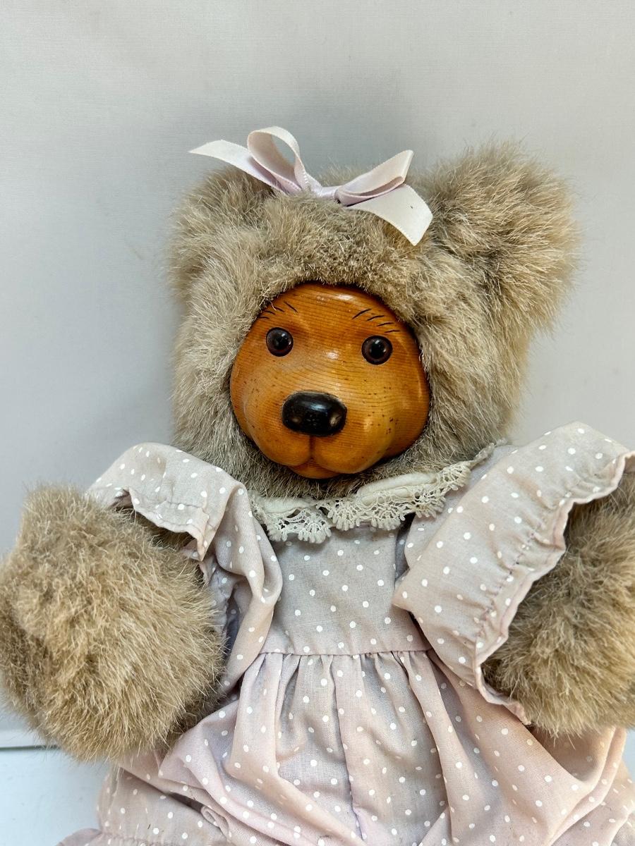 teddy bear with wooden face