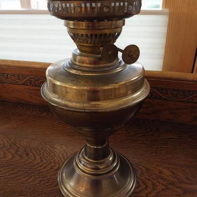ANTIQUE BRASS OIL LAMP WITH A GLASS GLOBE