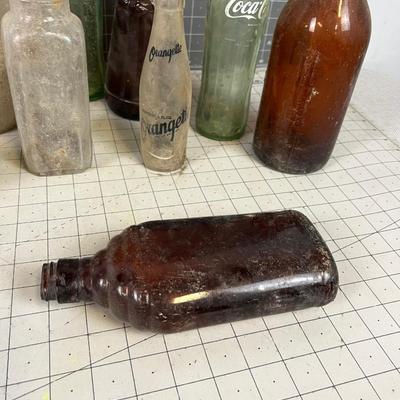 Bottles: Mrs. Butterworth, Coke, Beer other DUMP MINE BOTTLE