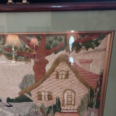 FRAMED NEEDLEPOINT PICTURE WITH A PAIR OF GLASS CANDLESTICKS