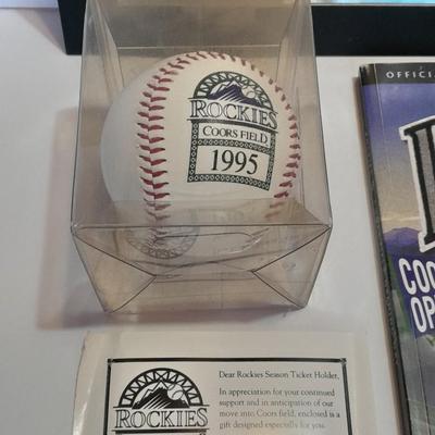 Rockies 1995 Coors Field ball, Rockies opening day scorecard magazine, collectors' pins and large matted ticket.