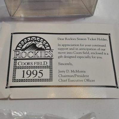 Rockies 1995 Coors Field ball, Rockies opening day scorecard magazine, collectors' pins and large matted ticket.