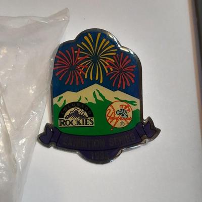 Rockies 1995 Coors Field ball, Rockies opening day scorecard magazine, collectors' pins and large matted ticket.