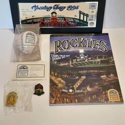 Rockies 1995 Coors Field ball, Rockies opening day scorecard magazine, collectors' pins and large matted ticket.