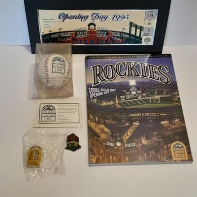 Rockies 1995 Coors Field ball, Rockies opening day scorecard magazine, collectors' pins and large matted ticket.