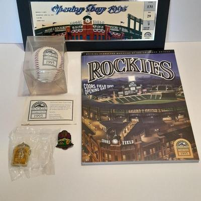 Rockies 1995 Coors Field ball, Rockies opening day scorecard magazine, collectors' pins and large matted ticket.