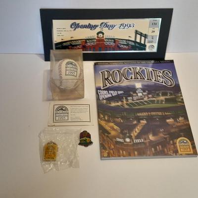 Rockies 1995 Coors Field ball, Rockies opening day scorecard magazine, collectors' pins and large matted ticket.