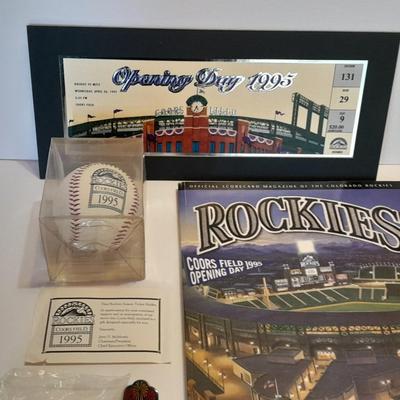 Rockies 1995 Coors Field ball, Rockies opening day scorecard magazine, collectors' pins and large matted ticket.