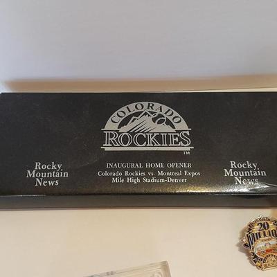 Colorado Rockies cased ticket stub, collectible pins and 1993 Inaugural Year black ball
