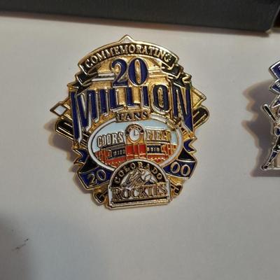 Colorado Rockies cased ticket stub, collectible pins and 1993 Inaugural Year black ball