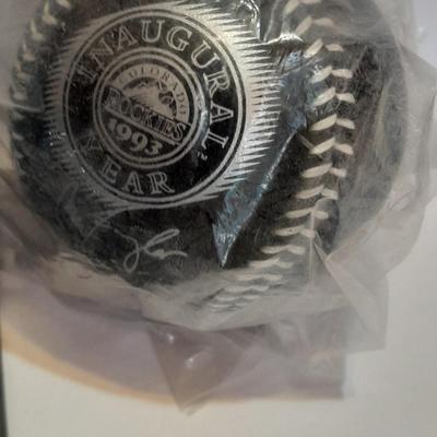 Colorado Rockies cased ticket stub, collectible pins and 1993 Inaugural Year black ball