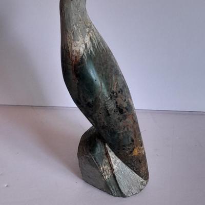 Signed stone Eagle statue with Zuni fetish pot cased in turquoise chips with feather accents.