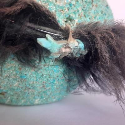 Signed stone Eagle statue with Zuni fetish pot cased in turquoise chips with feather accents.