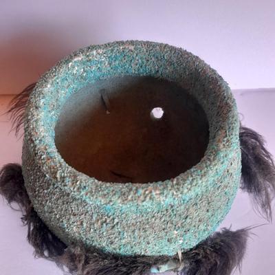 Signed stone Eagle statue with Zuni fetish pot cased in turquoise chips with feather accents.
