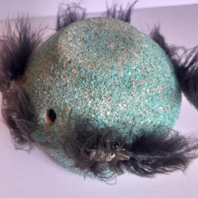 Signed stone Eagle statue with Zuni fetish pot cased in turquoise chips with feather accents.