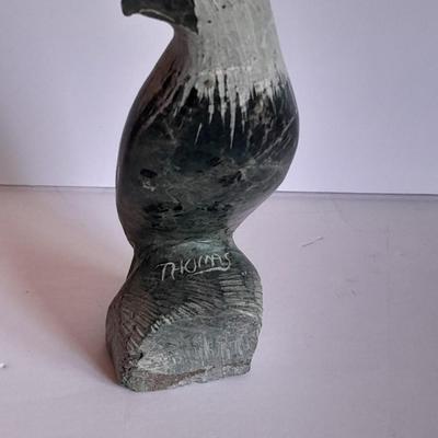 Signed stone Eagle statue with Zuni fetish pot cased in turquoise chips with feather accents.