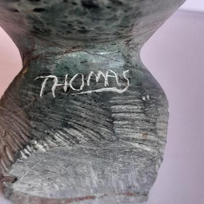 Signed stone Eagle statue with Zuni fetish pot cased in turquoise chips with feather accents.