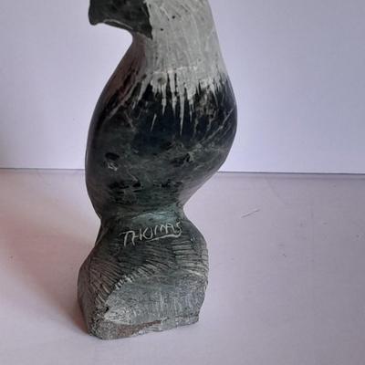 Signed stone Eagle statue with Zuni fetish pot cased in turquoise chips with feather accents.