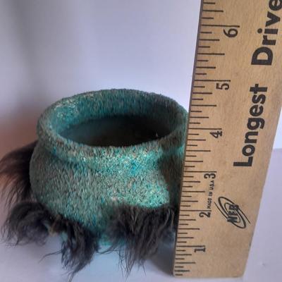 Signed stone Eagle statue with Zuni fetish pot cased in turquoise chips with feather accents.