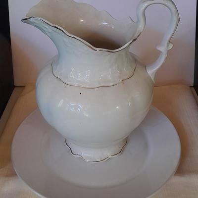 Large gold rimmed semiâ€“Vitreous Porcelain K.T. &M. pitcher on Dansk Platter