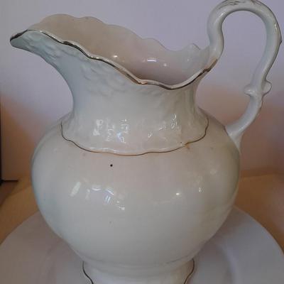 Large gold rimmed semiâ€“Vitreous Porcelain K.T. &M. pitcher on Dansk Platter