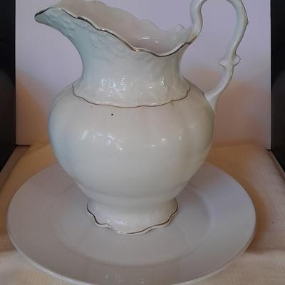 Large gold rimmed semiâ€“Vitreous Porcelain K.T. &M. pitcher on Dansk Platter