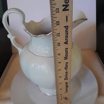 Large gold rimmed semiâ€“Vitreous Porcelain K.T. &M. pitcher on Dansk Platter