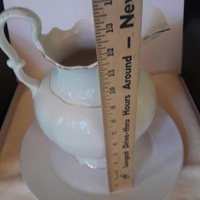 Large gold rimmed semiâ€“Vitreous Porcelain K.T. &M. pitcher on Dansk Platter