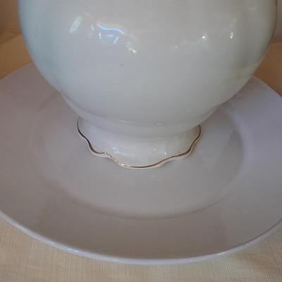 Large gold rimmed semiâ€“Vitreous Porcelain K.T. &M. pitcher on Dansk Platter