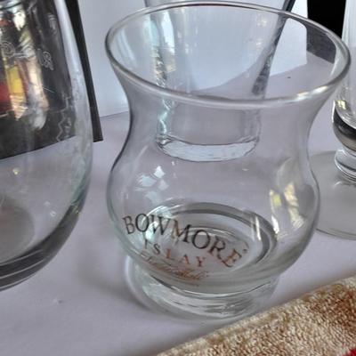 Barware, Rabbit corkscrew, assortment of drinking glasses, Cocktail recipe books, bar rags, Lee's bar coasters