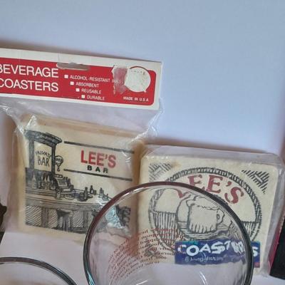 Barware, Rabbit corkscrew, assortment of drinking glasses, Cocktail recipe books, bar rags, Lee's bar coasters