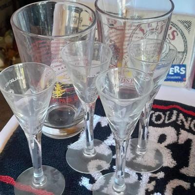 Barware, Rabbit corkscrew, assortment of drinking glasses, Cocktail recipe books, bar rags, Lee's bar coasters