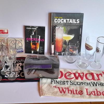 Barware, Rabbit corkscrew, assortment of drinking glasses, Cocktail recipe books, bar rags, Lee's bar coasters