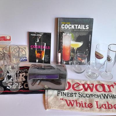 Barware, Rabbit corkscrew, assortment of drinking glasses, Cocktail recipe books, bar rags, Lee's bar coasters