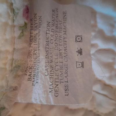 King sized embroidered rose quilted bedspread.