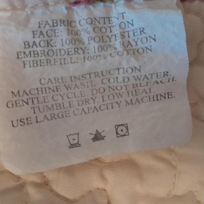 King sized embroidered rose quilted bedspread.