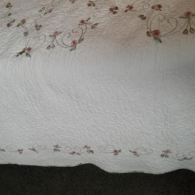King sized embroidered rose quilted bedspread.