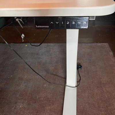 Powered desk that raises for standing and working