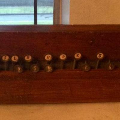 Stringed instrument with keys, wall hanger