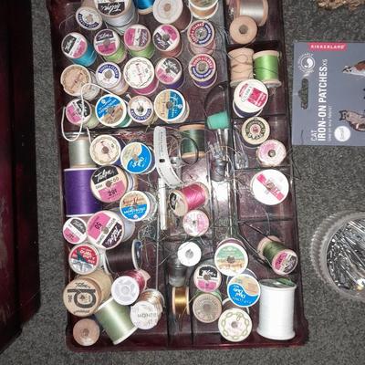 Plastic sewing box full of sewing notions, Thread, pin cushions, pins, and much more